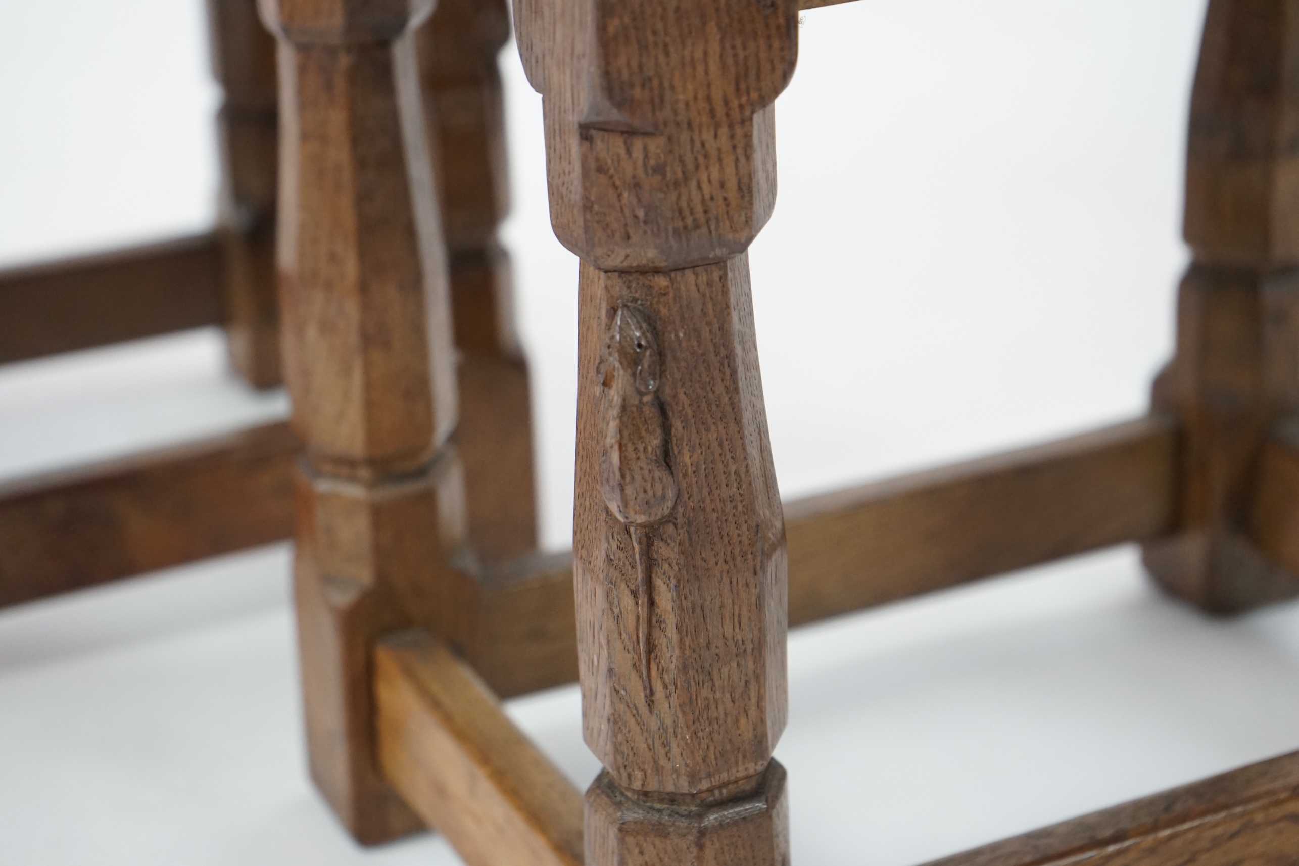 A pair of Robert 'Mouseman' Thompson burr oak stools, 1930s